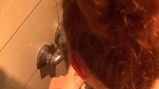 Horny redhead in the shower pleasures herself hamster porno